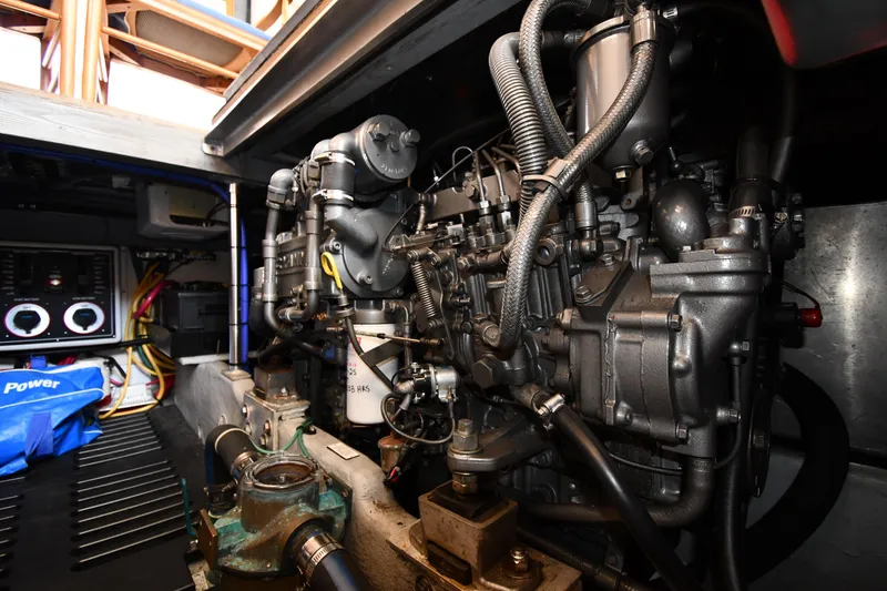 Slide: The Image of Engine room of 2006 Mainship 40 Trawler, showcasing detailed mechanical components. - 83