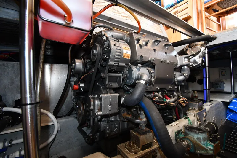 Slide: The Image of Engine room of 2006 Mainship 40 Trawler, showcasing detailed mechanical components. - 84
