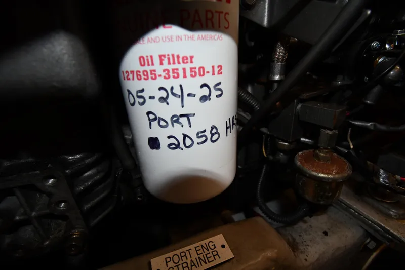 Slide: The Image of Oil filter in Mainship 40 Trawler engine, marked with date and hours, 2006 model. - 86