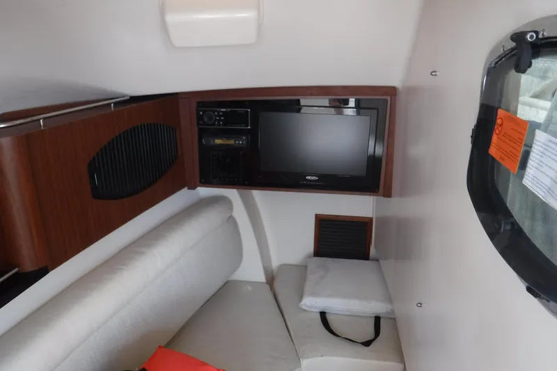 Slide: The Image of Interior of 2016 Grady White 355 Freedom boat with TV and seating area. - 10