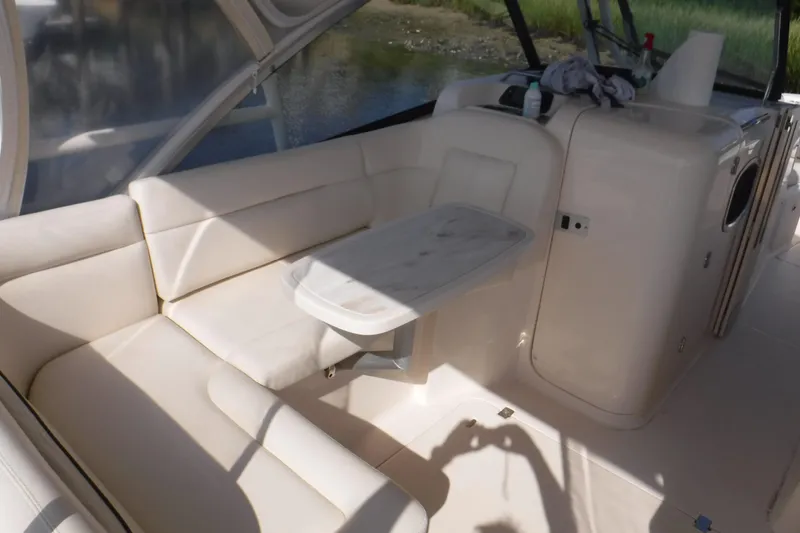 Slide: The Image of Interior of 2016 Grady White 355 Freedom boat with white seating and table. - 11