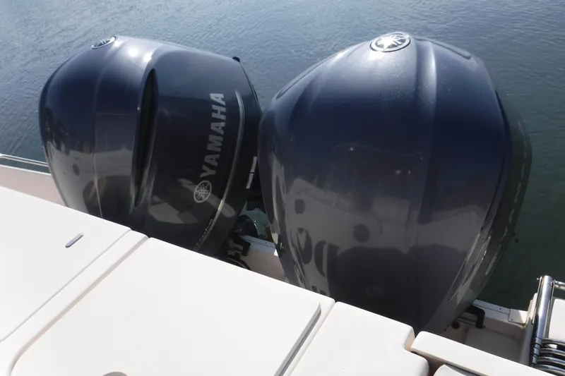 Slide: The Image of Twin Yamaha outboard engines on a 2016 Grady White 355 Freedom boat. - 13