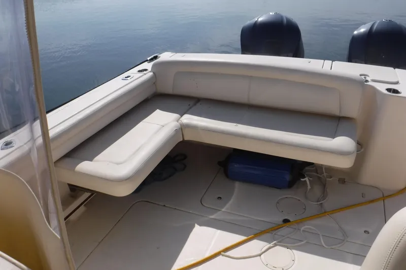 Slide: The Image of 2016 Grady White 355 Freedom boat interior with cushioned seating and twin engines. - 3