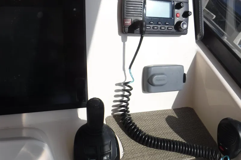 Slide: The Image of Control panel of 2016 Grady White 355 Freedom boat with radio and joystick. - 4