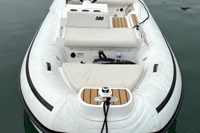 Slide: The Image of Inflatable boat AB 380, 2019 model, with seating and storage, floating on calm water. - 3