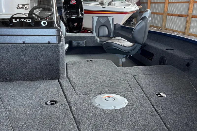 Slide: The Image of Minn Kota Terrova motor on 2026 Lund 1775 Adventure SS boat in a storage facility. - 10