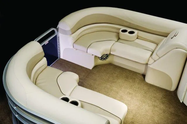 Slide: The Image of Manufacturer Provided Image: 2015 Bennington 2275 GCW boat interior with beige seating and cup holders. - 10