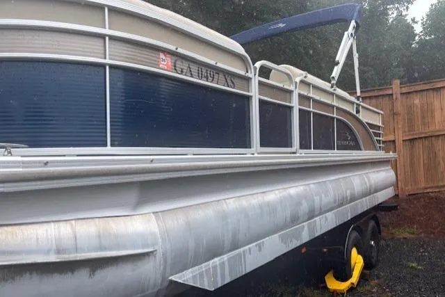 Slide: The Image of 2015 Bennington 2275 GCW pontoon boat on trailer, parked outdoors. - 4