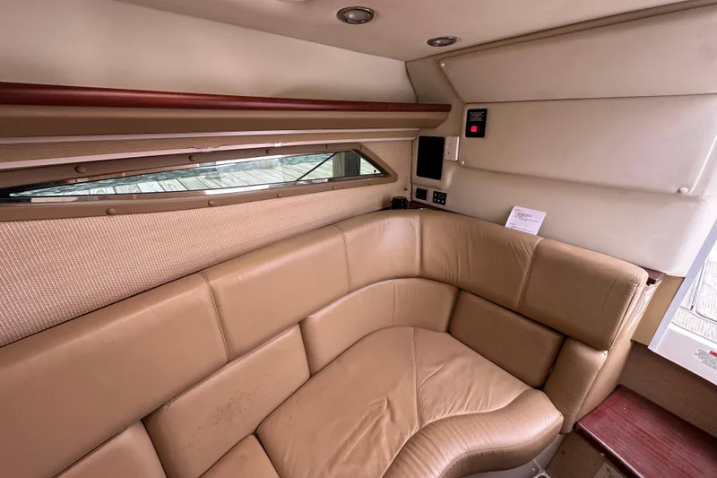Slide: The Image of Luxurious interior of 2015 Cobalt 336 boat with tan leather seating and modern amenities. - 25