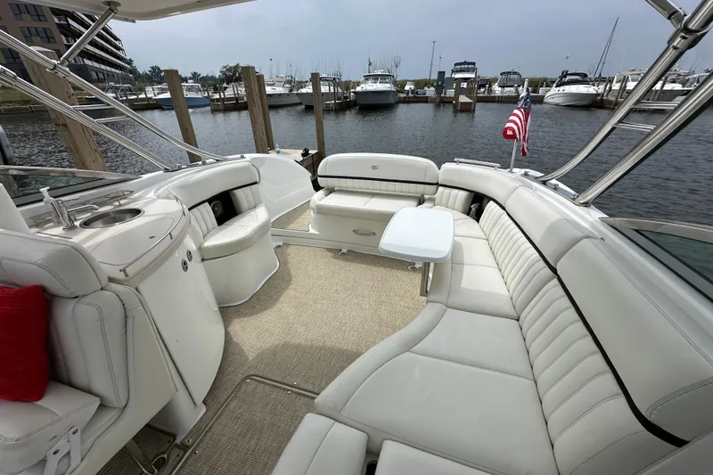 Slide: The Image of Luxurious 2015 Cobalt 336 boat interior with plush seating and marina view. - 9