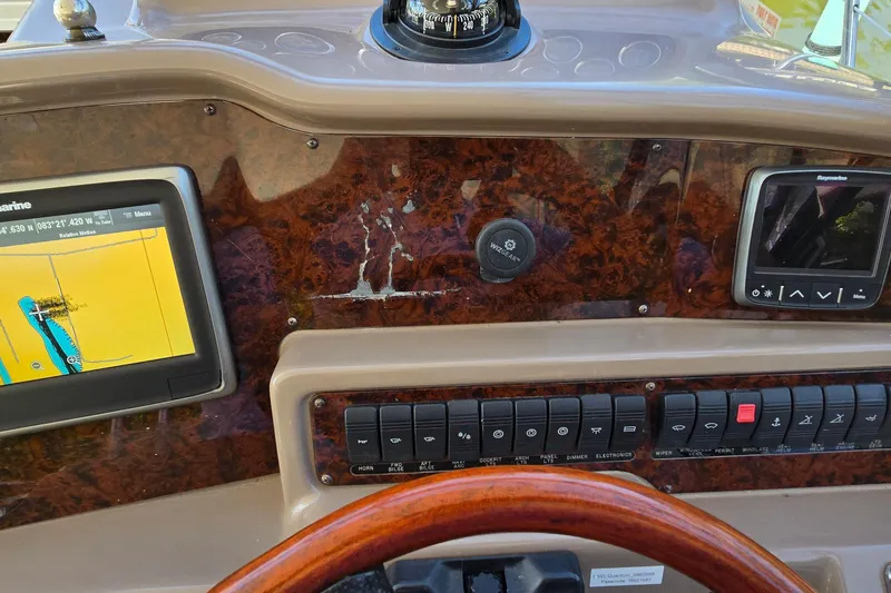 Slide: The Image of 2003 Regal Commodore 4260 dashboard with navigation screens and control panel. - 12