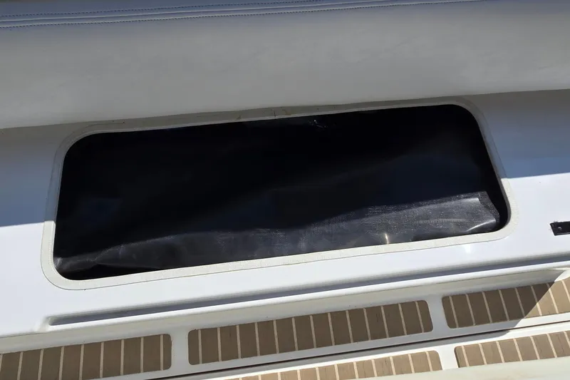 Slide: The Image of Storage compartment on a 2003 Regal Commodore 4260 boat deck. - 22