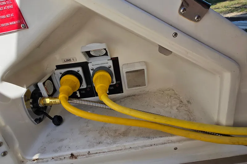 Slide: The Image of Electrical connections on a 2003 Regal Commodore 4260 boat, featuring yellow power cables. - 30
