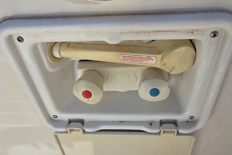 Slide: The Image of Outdoor shower controls on a 2003 Regal Commodore 4260 boat. - 31