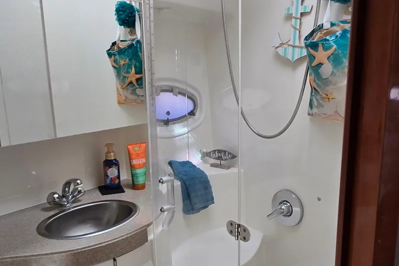 Slide: The Image of Bathroom interior of 2003 Regal Commodore 4260 yacht with shower and sink. - 38