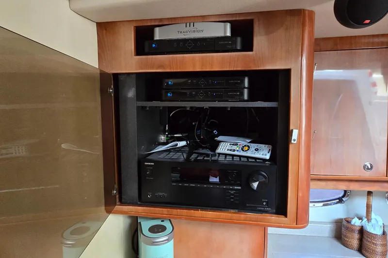 Slide: The Image of Entertainment system in a 2003 Regal Commodore 4260 yacht with audio and video equipment. - 46