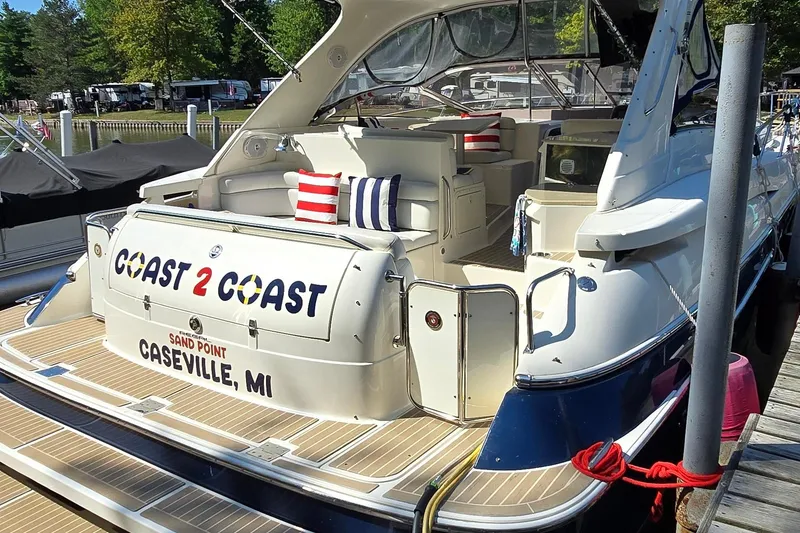 Slide: The Image of 2003 Regal Commodore 4260 yacht docked in Caseville, MI, with colorful cushions. - 5