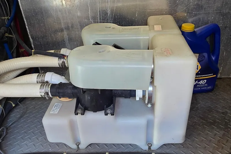 Slide: The Image of Marine bilge pump system on a 2003 Regal Commodore 4260 with motor oil container. - 70