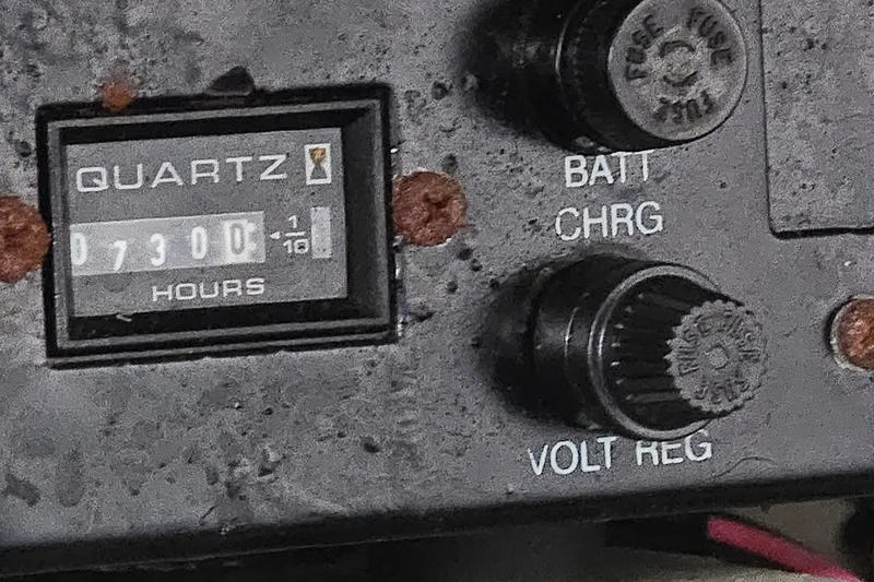 Slide: The Image of Close-up of a 2003 Regal Commodore 4260 control panel with hour meter. - 74