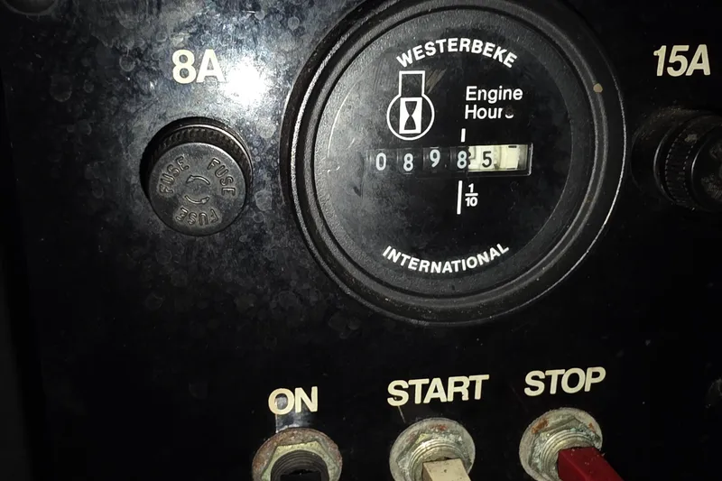 Slide: The Image of Control panel of a 1998 Sea Ray 370 Sundancer showing engine hours and fuse settings. - 31