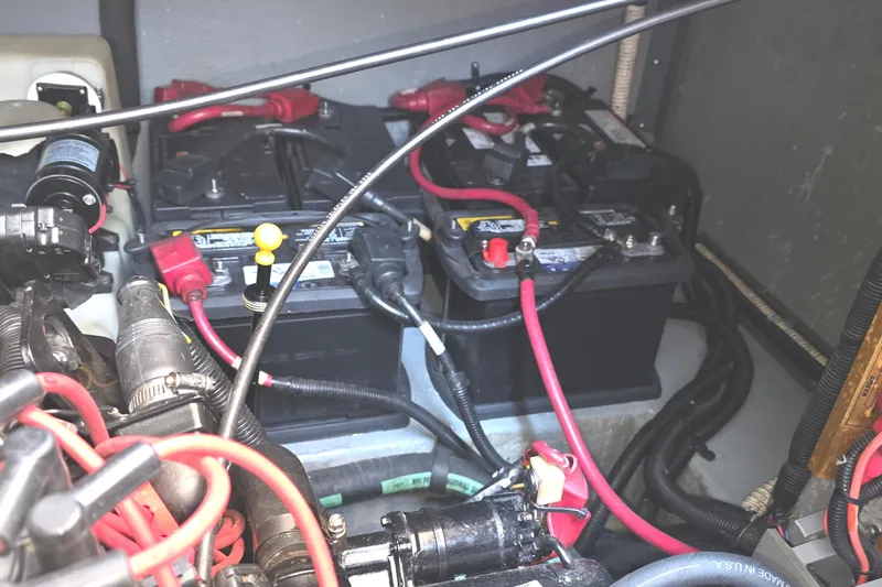 Slide: The Image of Engine compartment of a 1998 Sea Ray 370 Sundancer with visible batteries and wiring. - 33