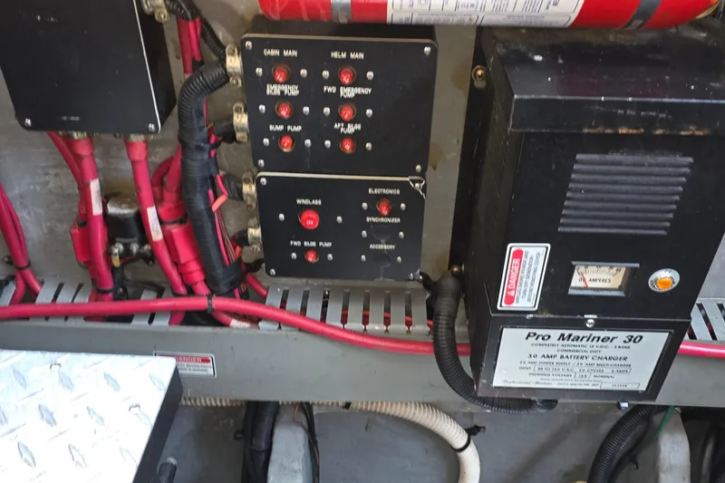 Slide: The Image of Electrical panel and battery charger in 1998 Sea Ray 370 Sundancer boat. - 34