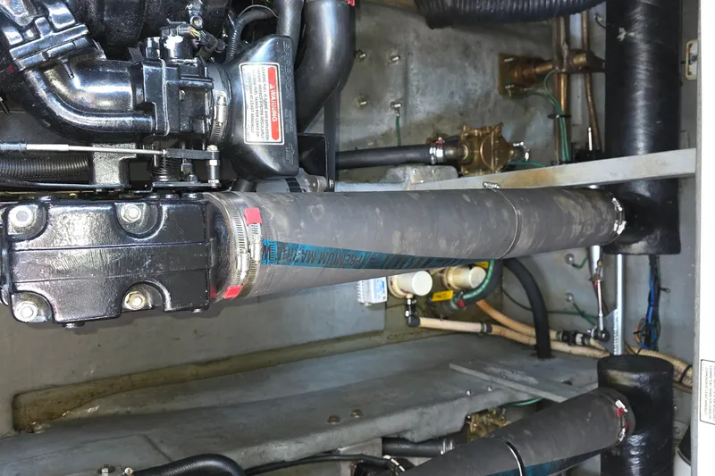 Slide: The Image of Engine compartment of a 1998 Sea Ray 370 Sundancer boat, showing mechanical components. - 36