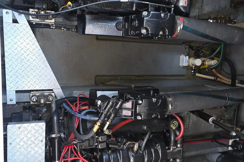 Slide: The Image of Engine compartment of a 1998 Sea Ray 370 Sundancer with visible components and wiring. - 39
