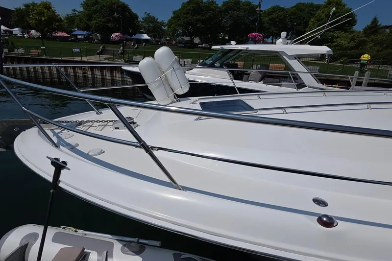 Slide: The Image of 1998 Sea Ray 370 Sundancer yacht docked at marina, sunny day, clear water. - 8