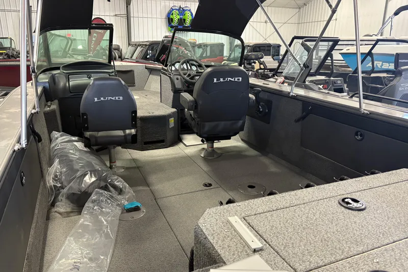 Slide: The Image of 2023 Nordlund 2075 FISHERMAN boat interior with seating and steering console. - 10