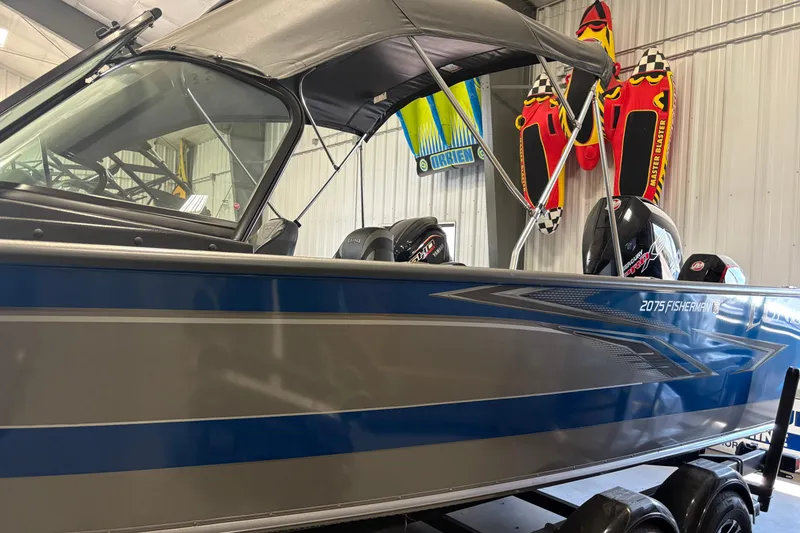 Slide: The Image of 2023 Nordlund 2075 FISHERMAN boat in showroom with vibrant design and accessories. - 6