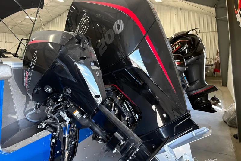 Slide: The Image of 2023 Nordlund 2075 FISHERMAN boat with powerful outboard motors in a showroom. - 9