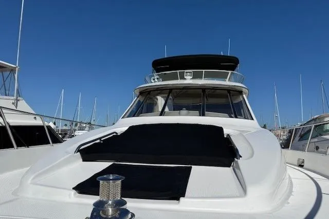 Slide: The Image of 2001 Bayliner 5288 Pilot House Motoryacht docked under clear blue sky. - 39