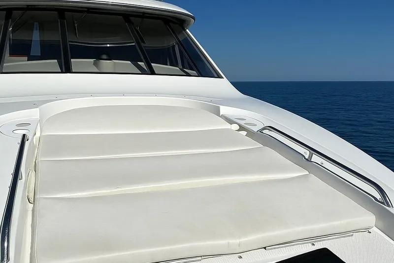 Slide: The Image of 2001 Bayliner 5288 Pilot House Motoryacht deck with cushioned seating, ocean view. - 40