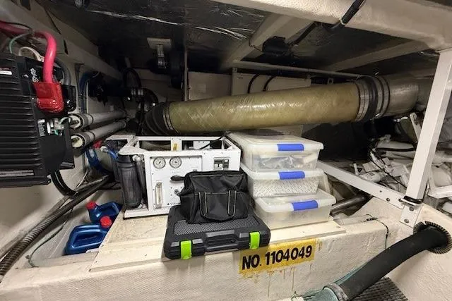 Slide: The Image of Engine room of 2001 Bayliner 5288 Pilot House Motoryacht with equipment and storage boxes. - 44