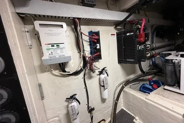 Slide: The Image of Engine room of 2001 Bayliner 5288 Pilot House Motoryacht with electrical systems and fire extinguishers. - 45