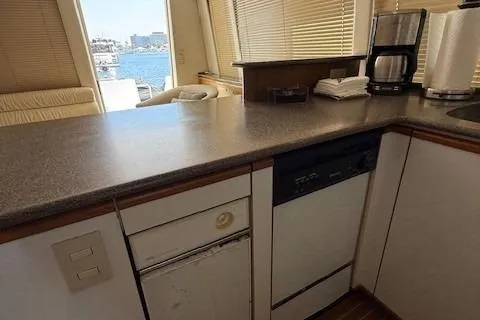 Slide: The Image of 2001 Bayliner 5288 Pilot House Motoryacht deck with chairs, docked at marina. - 6