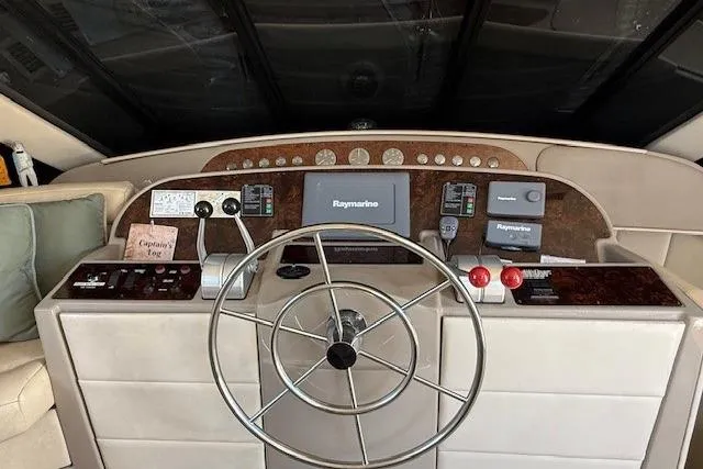 Slide: The Image of Luxurious interior of 2001 Bayliner 5288 Pilot House Motoryacht with modern furnishings. - 7