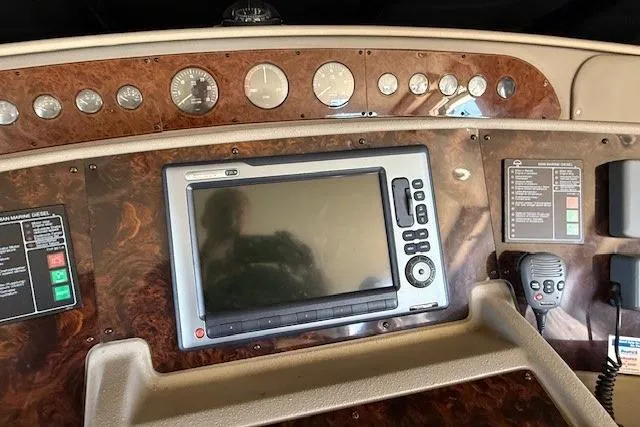 Slide: The Image of Luxurious interior of 2001 Bayliner 5288 Pilot House Motoryacht with plush seating and large windows. - 8