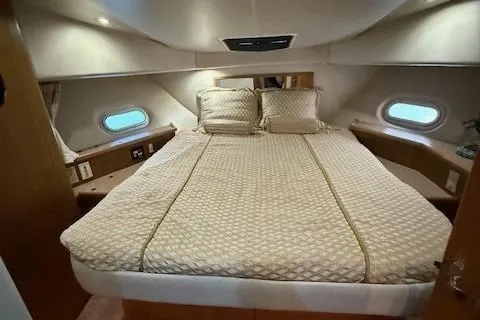 Slide: The Image of 2001 Bayliner 5288 Pilot House Motoryacht kitchen with modern appliances and wooden cabinetry. - 9