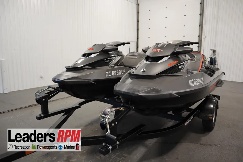 Slide: The Image of 2013 Sea-Doo GTX 260 iS Limited jet skis on trailer in showroom. - 1