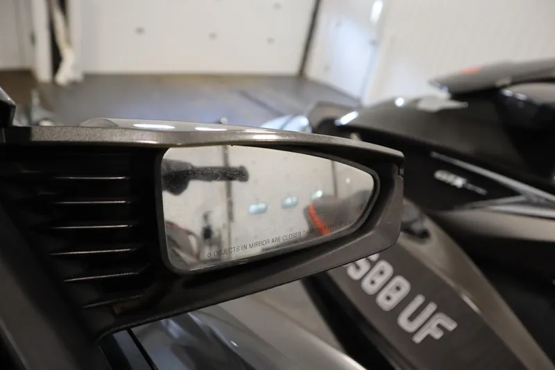 Slide: The Image of Close-up of 2013 Sea-Doo GTX 260 iS Limited side mirror in a garage setting. - 13