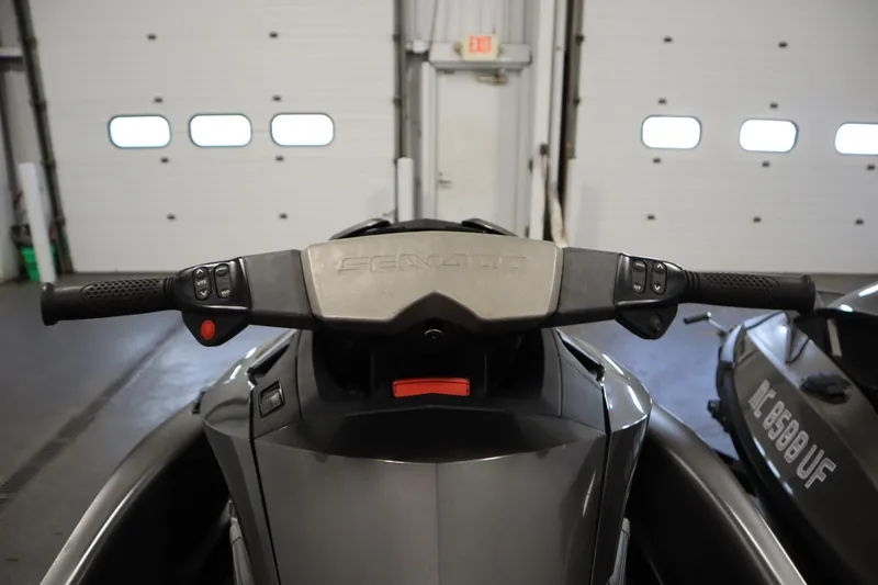 Slide: The Image of 2013 Sea-Doo GTX 260 iS Limited handlebars in a garage setting. - 14