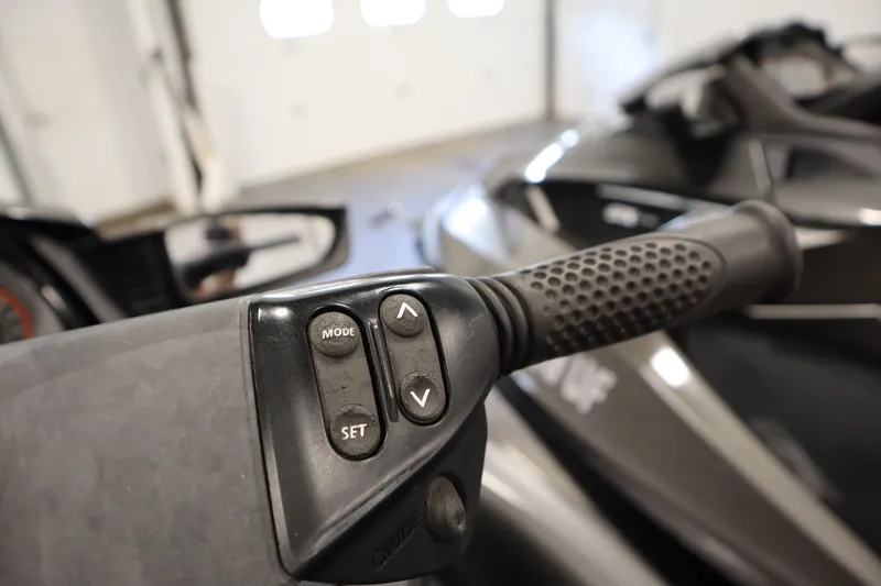 Slide: The Image of Close-up of 2013 Sea-Doo GTX 260 iS Limited handlebar controls in a garage. - 16