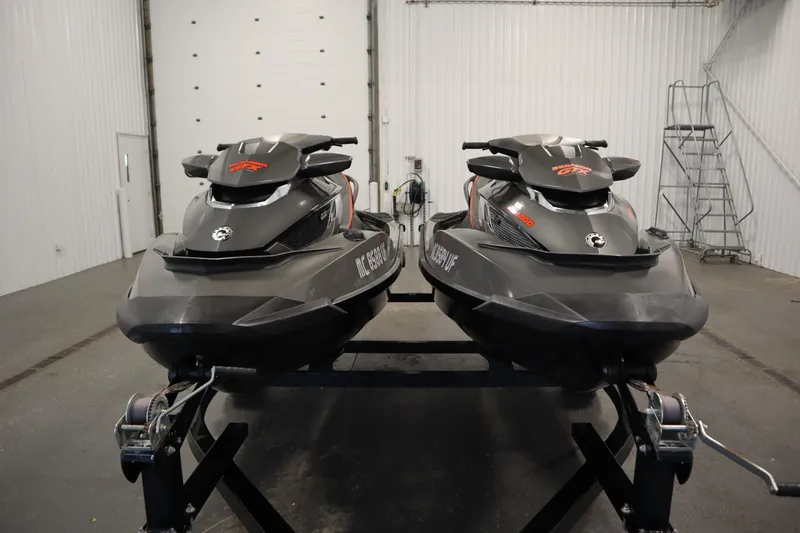 Slide: The Image of 2013 Sea-Doo GTX 260 iS Limited jet skis in a garage setting. - 2