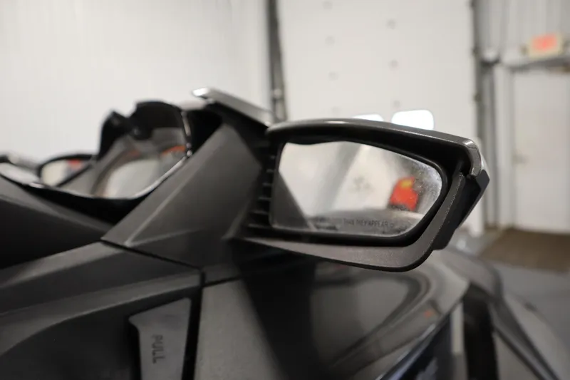 Slide: The Image of Close-up of 2013 Sea-Doo GTX 260 iS Limited side mirror in a garage. - 28