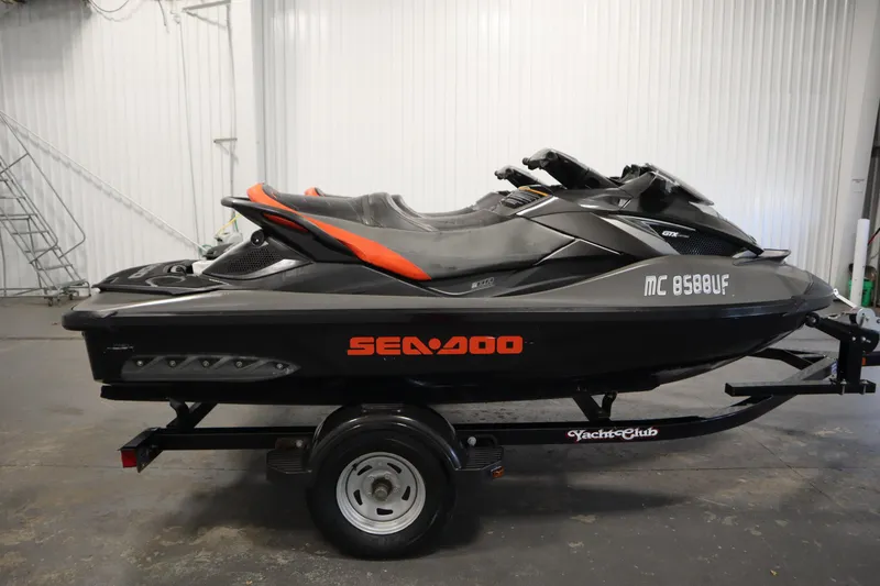 Slide: The Image of 2013 Sea-Doo GTX 260 iS Limited jet ski on trailer in garage. - 4