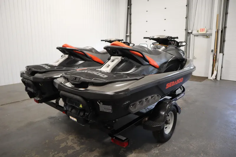 Slide: The Image of 2013 Sea-Doo GTX 260 iS Limited jet skis on trailer in garage setting. - 5