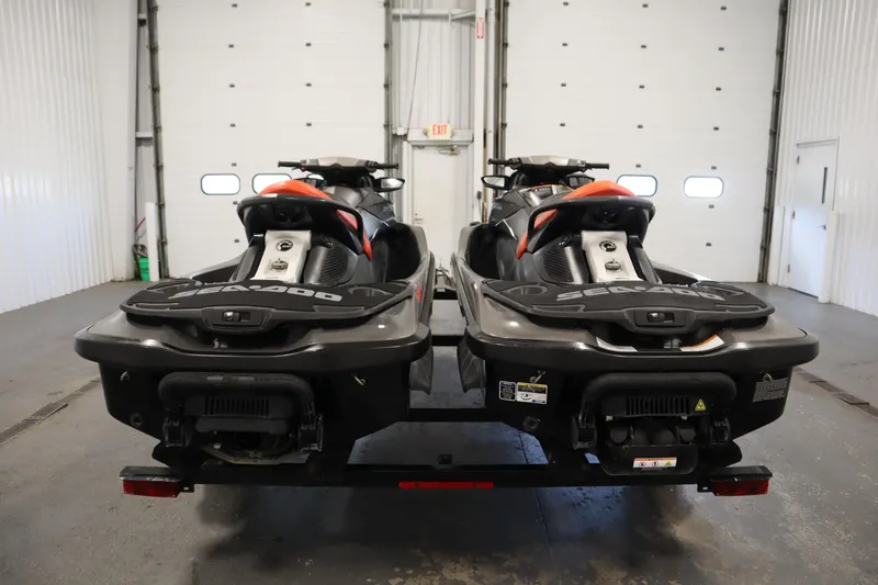 Slide: The Image of 2013 Sea-Doo GTX 260 iS Limited jet skis in a garage setting. - 6