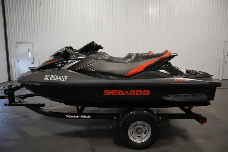 Slide: The Image of 2013 Sea-Doo GTX 260 iS Limited jet ski on trailer in indoor setting. - 8